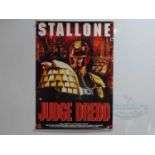 A group of three video posters comprising the titles JUDGE DREDD (1995), TOP GUN (1986), and