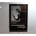 A pair of US one sheet movie posters comprising THE ENFORCER (1977) - tearing to bottom left