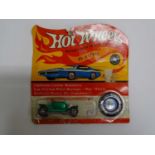 A MATTEL Hot Wheels Redline 1970 'Hot Heap' in metallic green partially unsealed on original card