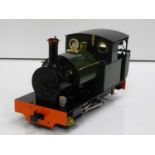 An ACCUCRAFT G scale 32mm live steam 0-4-0 steam saddle tank locomotive in green livery, fitted with