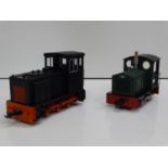 A pair of G scale diesel locomotives comprising a metal bodied battery operated example (possibly