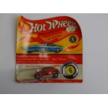 A MATTEL Hot Wheels Redline 1970 'Custom Volkswagen' in metallic red partially unsealed on