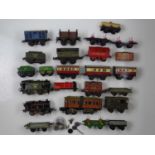 A group of HORNBY O gauge clockwork locos, tenders, wagons and coaches, mostly for spares or