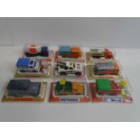 A group of MAJORETTE vans and trucks all sealed in original bubble packs - VG/E in G/VG packs (9)