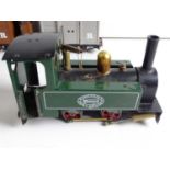 A MAMOD live steam 32mm scale 0-4-0 steam tank locomotive in green together with 3x wagons, all