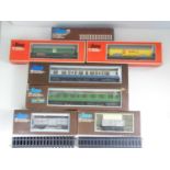 A group of LIMA O gauge rolling stock comprising 2x Mark 1 coaches, 4x wagons together with a box of