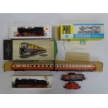 A group of HO gauge German outline steam and diesel locomotives and a diesel railcar by