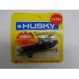 A HUSKY 1403 Batboat with Batman and Robin figures sealed on original backing card with punch tag