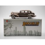 A BROOKLIN BRK.156 hand built white metal, 1:43 scale model of a 1937 Oldsmobile L-37 touring sedan,