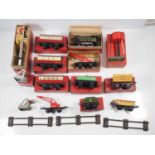 A group of HORNBY O gauge items comprising clockwork No 51 loco and tender, wagons, coaches and