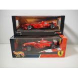 A pair of HOTWHEELS 1:18 scale Ferrari Formula 1 diecast racing cars comprising 1999 and 2000