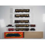 A group of TRI-ANG HORNBY OO gauge rolling stock comprising a class 37 diesel locomotive (VG in