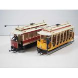 A pair of BACHMANN Big Haulers G gauge 4-wheel tram cars in two different styles of United