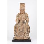 A large carved wood seated figure. China, late Ming dynasty