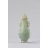 A celadon jade vase with cover. China, 19th century