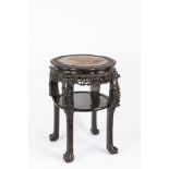 A carved wood occasional table. China, early 20th century