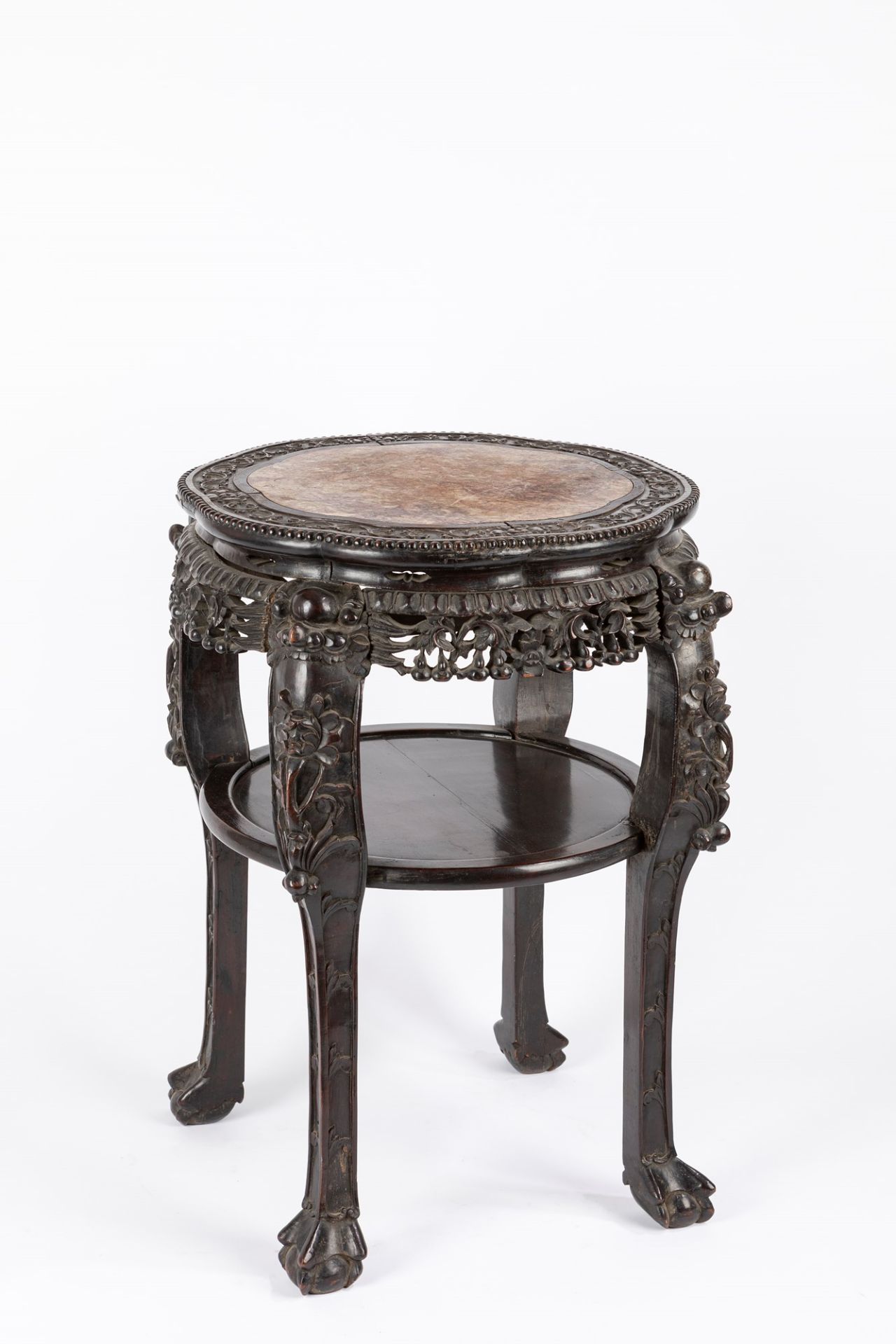 A carved wood occasional table. China, early 20th century