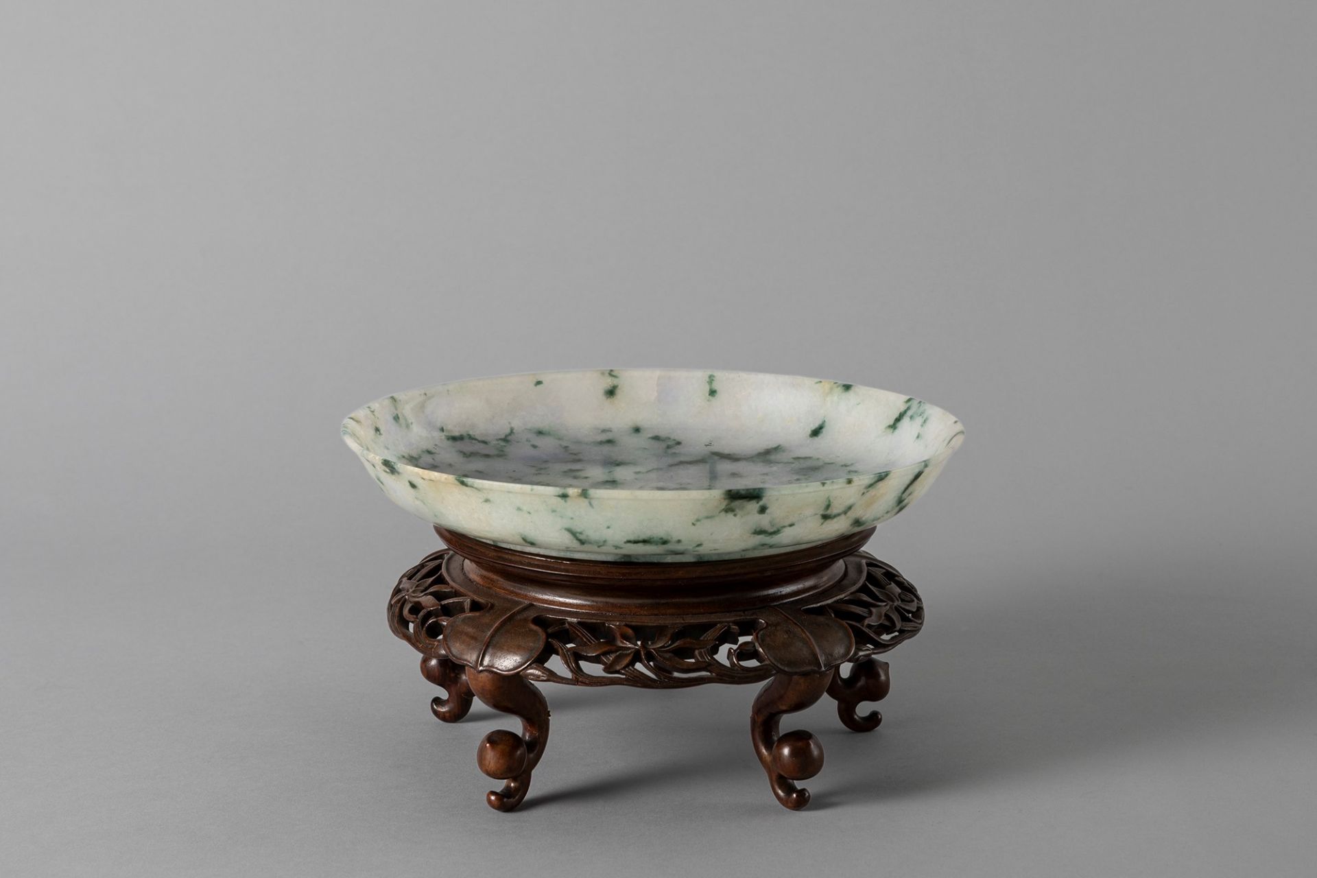 An apple green jade plate. China, late Qing dynasty