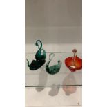 Three cut glass swans