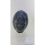 Art pottery egg on metal stand