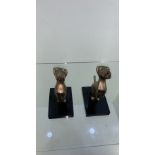 Pair of metal dog bookends on stone base