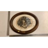 Charcoal drawing of a dog in oval frame
