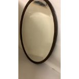 Antique oval mahogany mirror