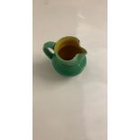 Studio pottery Small green jug - signed underneath