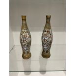 A pair of vases depicting ancient Greek figures