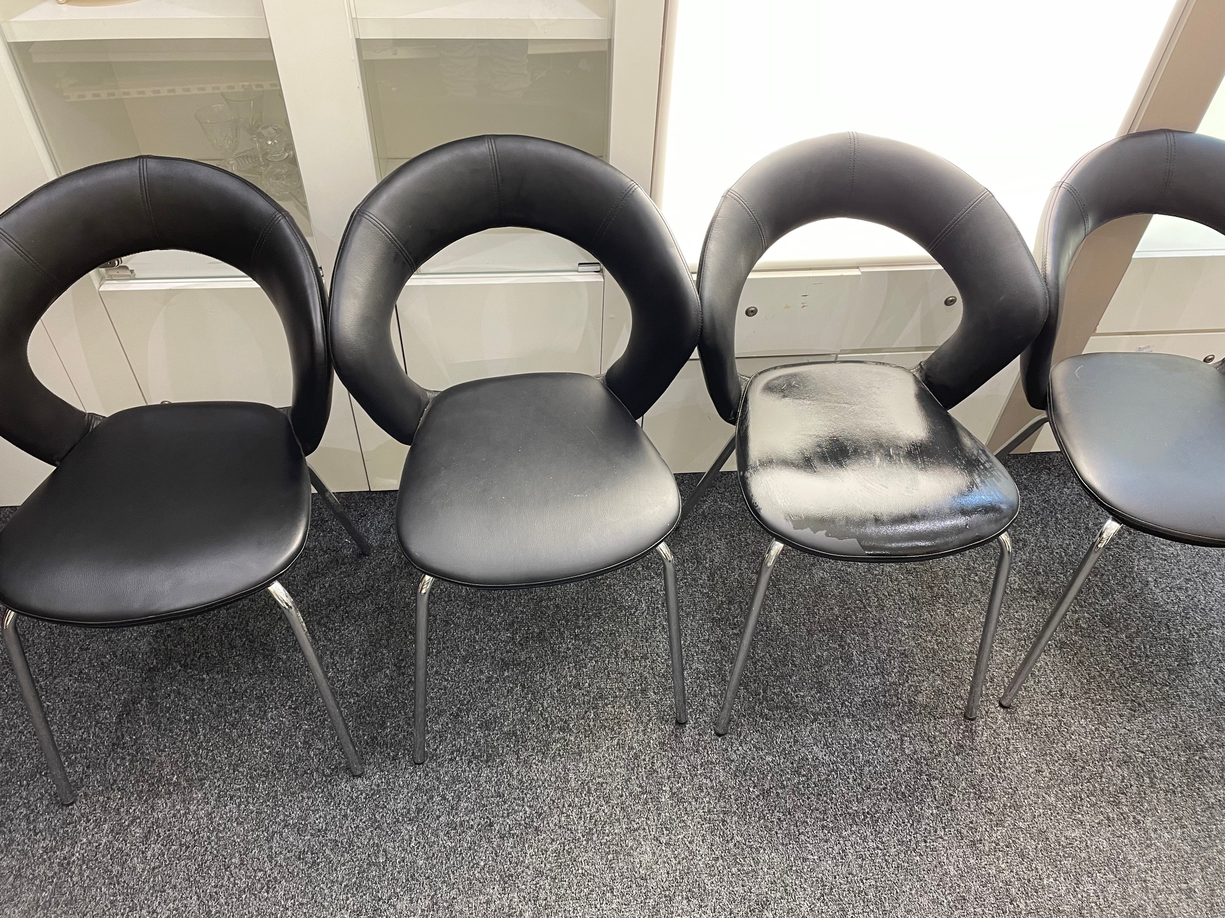 4 Retro black leather chairs with rounded tops