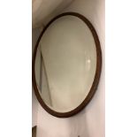 Antique wooden oval mirror