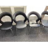 4 Retro black leather chairs with rounded tops