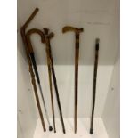 Job lot of walking sticks carved and silver topped