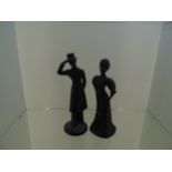figurines of a victorian lady and gentleman