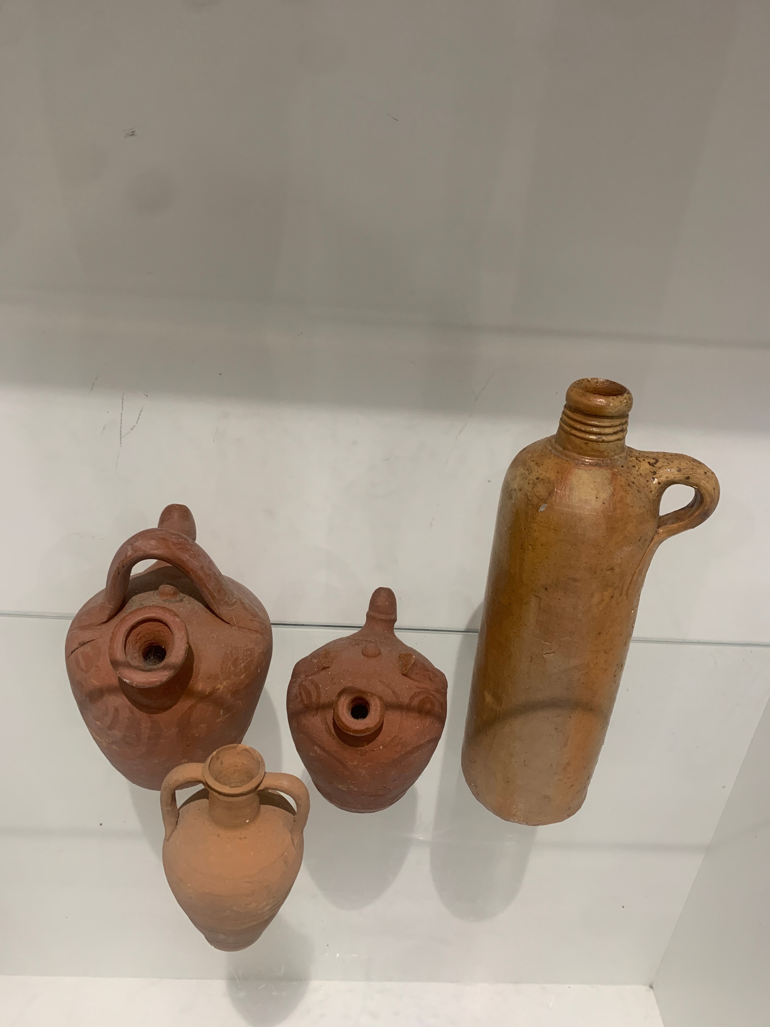 3 terrcotor jugs and anntique water bottle