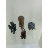 4 elephants figurines icluding red resin