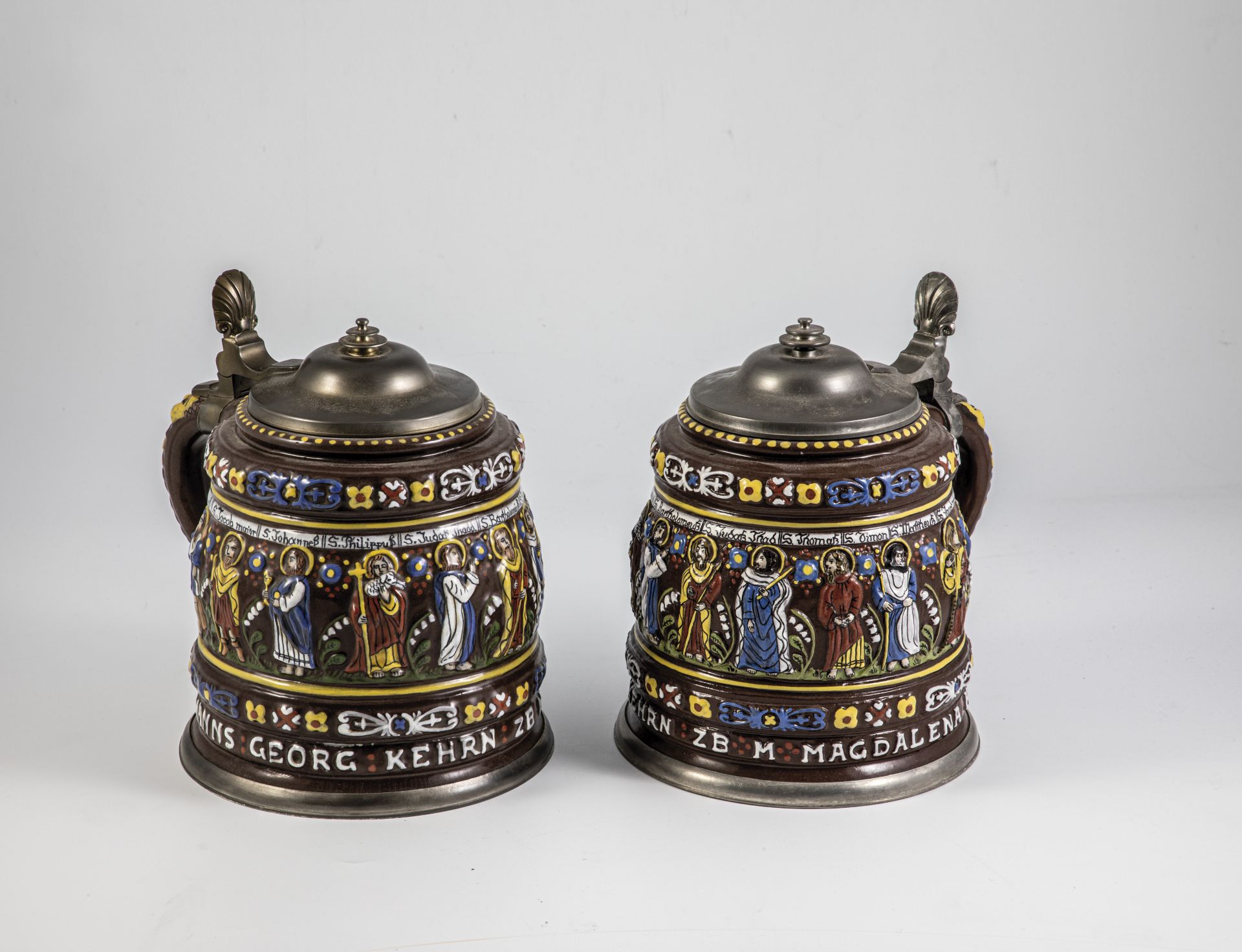 Pair of apostle jars with relief overlays