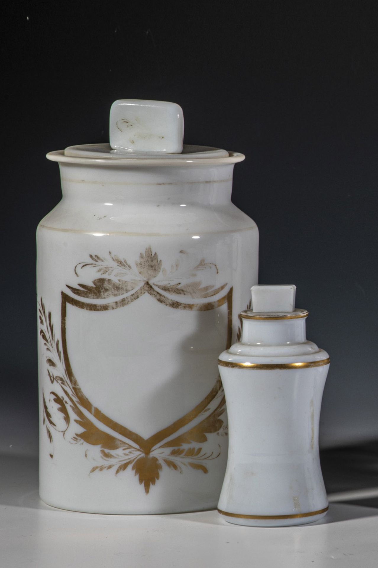Two pharmacy jars with lids