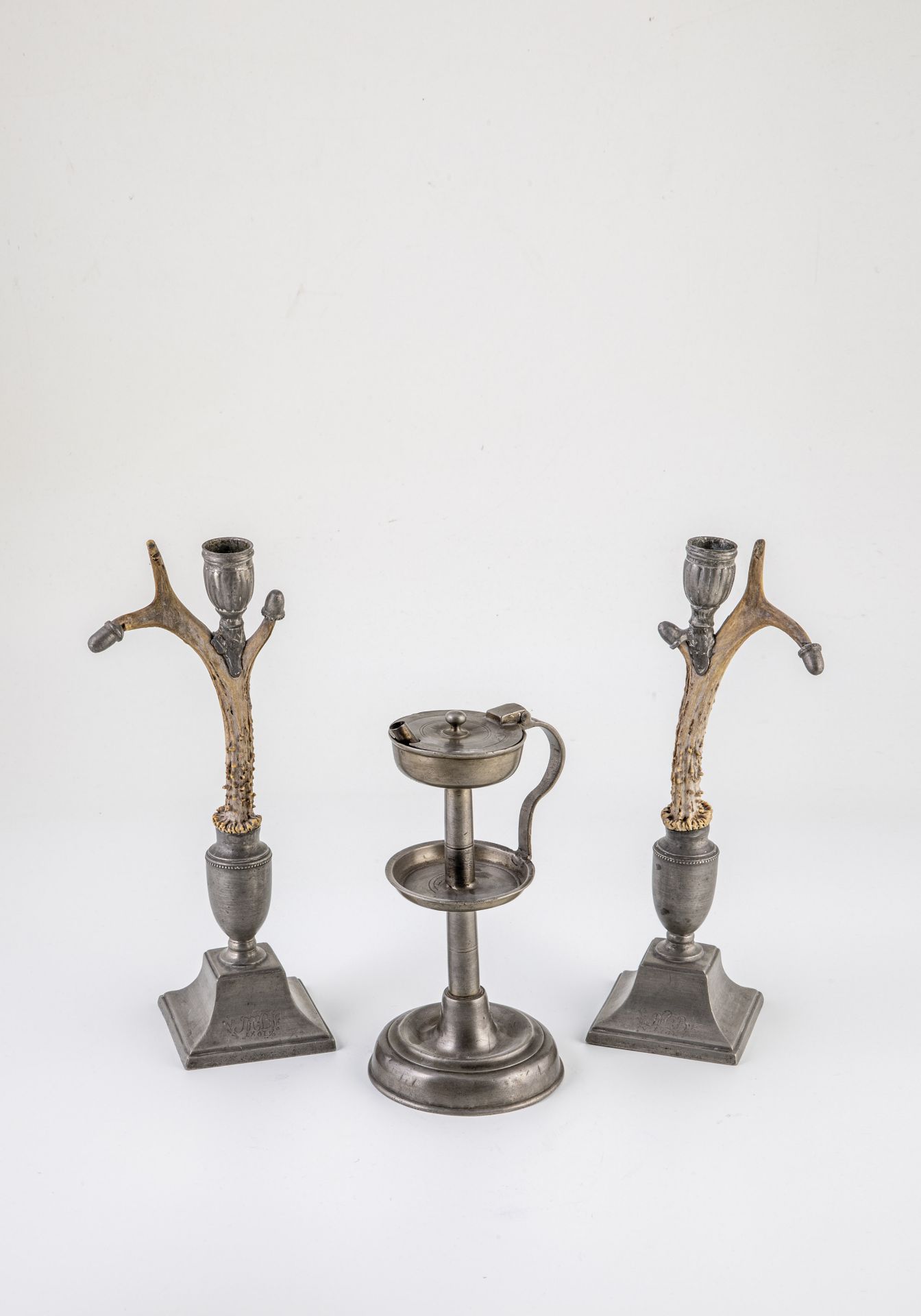 Pair of candlesticks and oil lamp