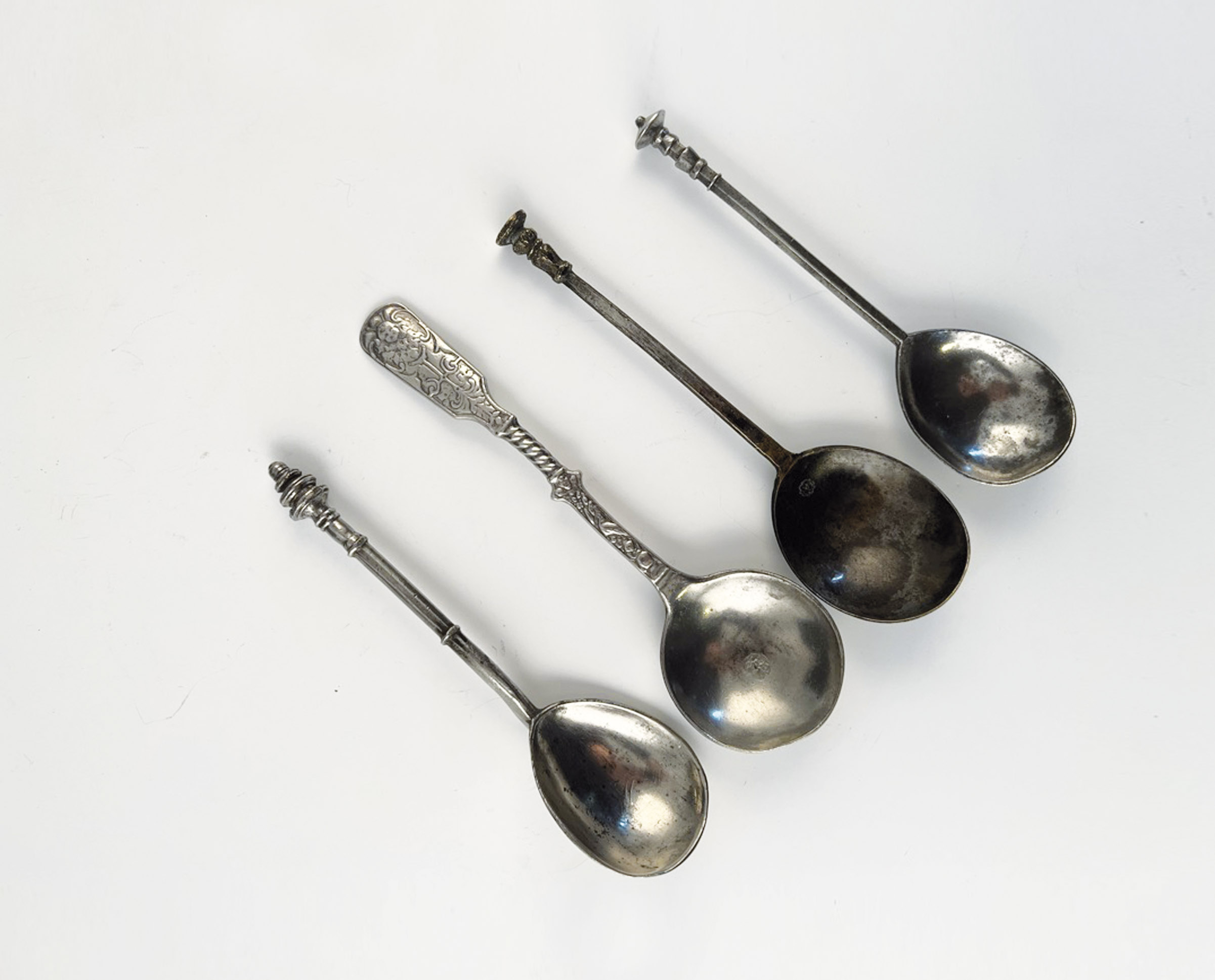 Four pewter spoons
