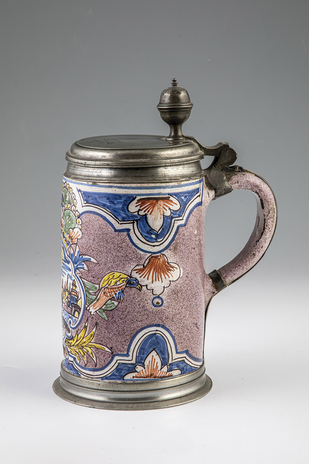 Roller pitcher with pewter mount