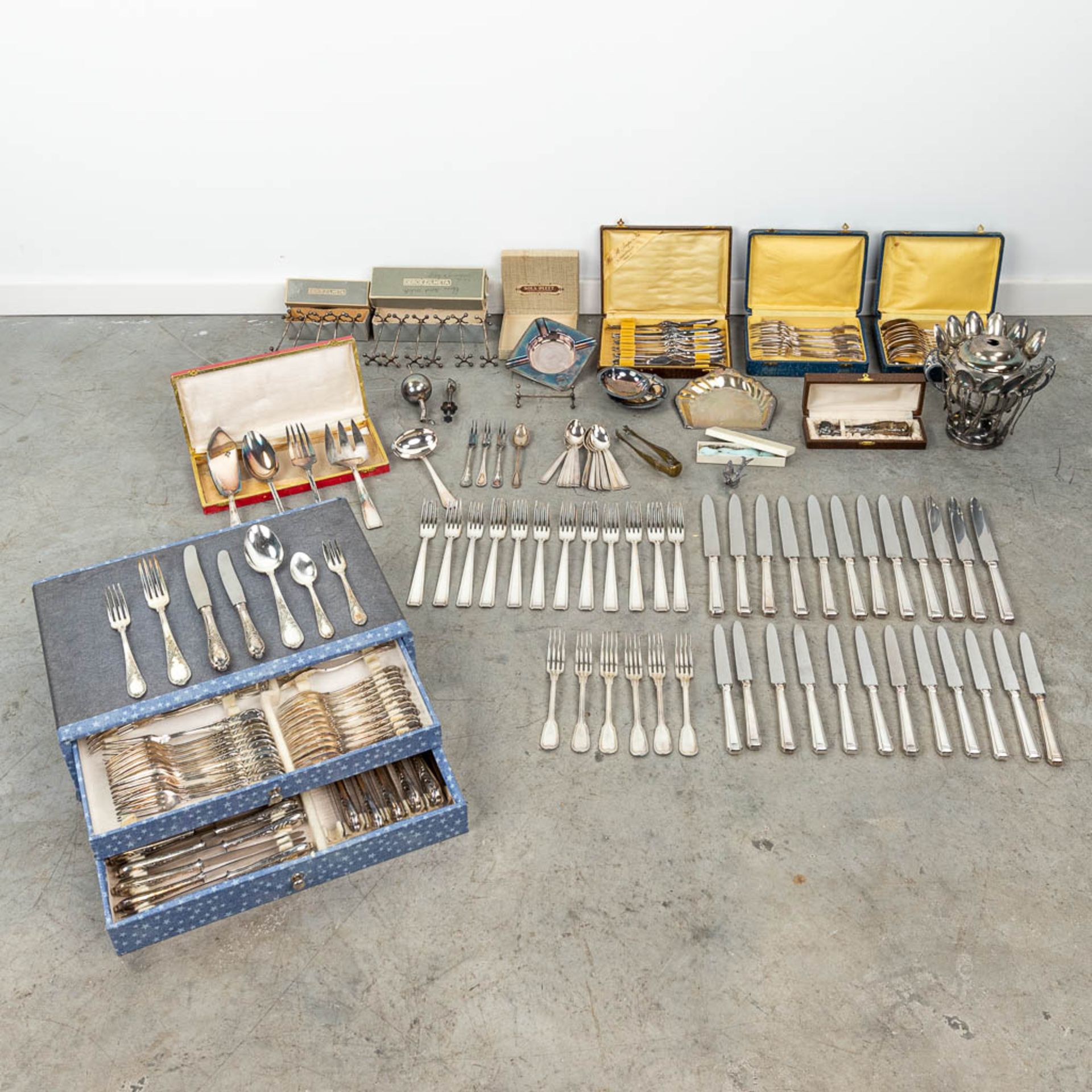 An assembled collection of silver-plated cutlery and accessories.