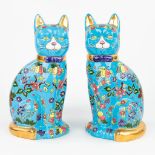 A pair of decorative cats made of glazed faience in the style of 'Emaux de Longwy'. (H:36cm)