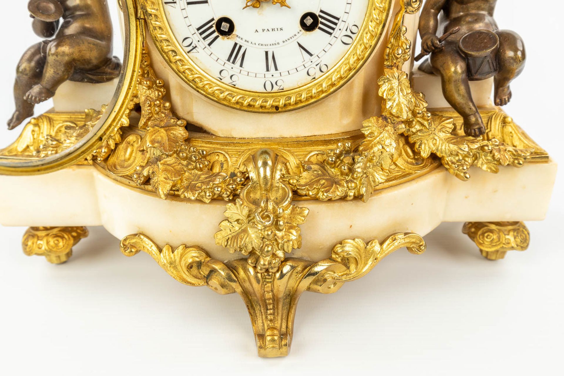 A clock made of marble and decorated with gilt and patinated bronze in Louis XVI style. (H:42cm) - Image 10 of 12