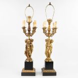 A pair of table lamps in the shape of the three graces made of gilt bronze in Hollywood Regency. (H: