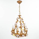 A chandelier made of brass and finished with porcelain flowers. (H:50cm)