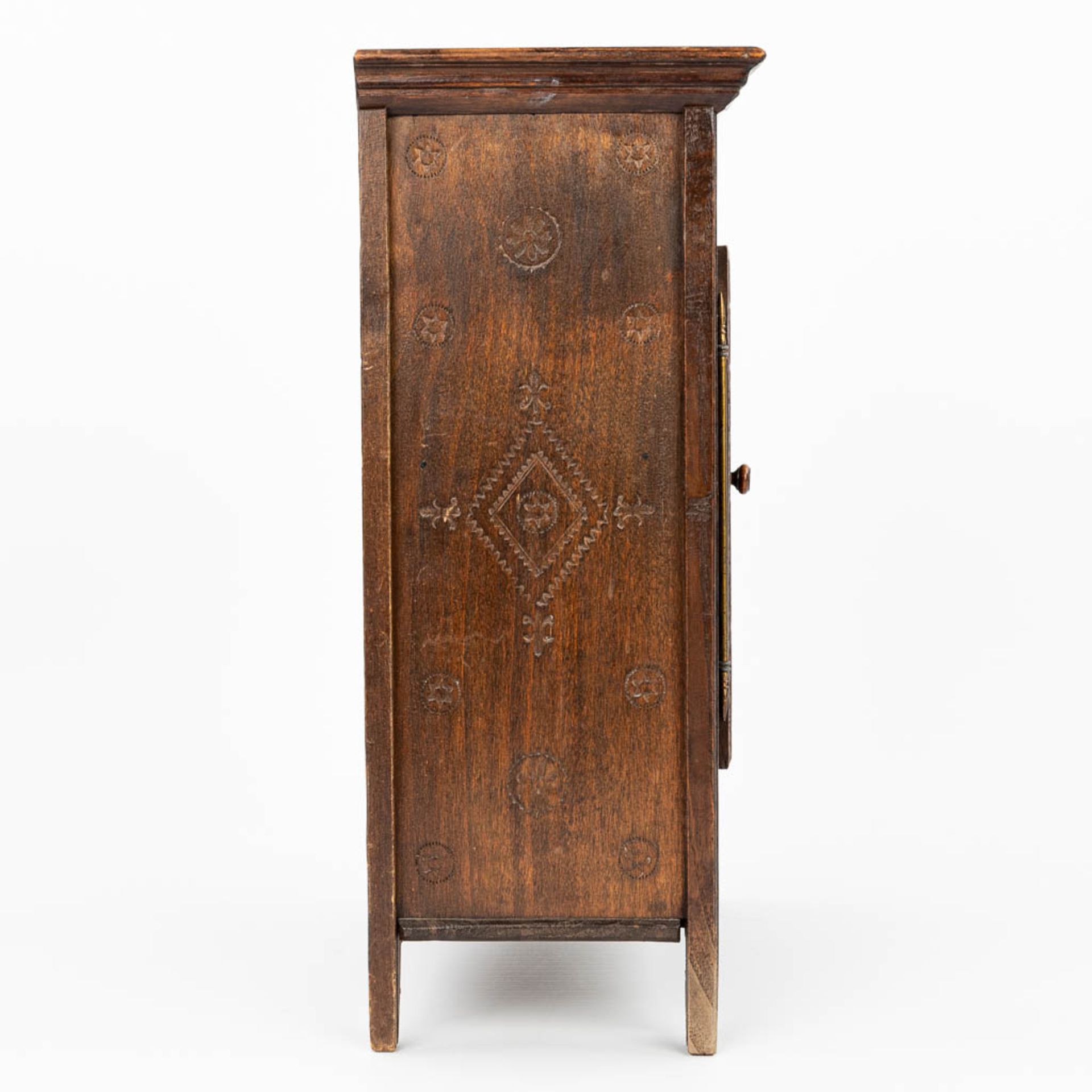 A miniature Breton cabinet, made of sculptured wood. (H:37cm) - Image 8 of 14