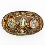 An antique relic in an oval box, marked Agnus Dei, H Reliques.