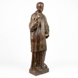 A wood sculpture of a priest, 19th century. (H:103cm)