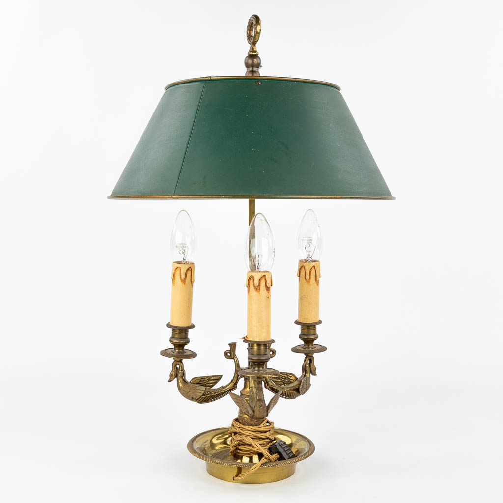 A table lamp made of bronze and decorated with swans in Empire style. (H:56cm)